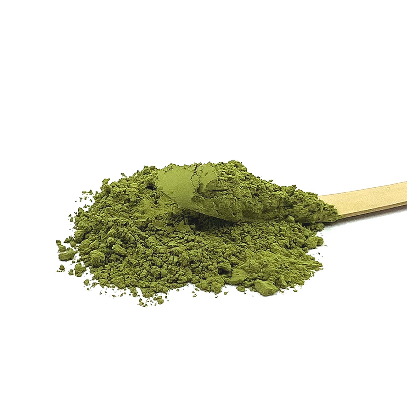 Wooden powdered tea scoop with ceremonial grade powdered green tea on a white background