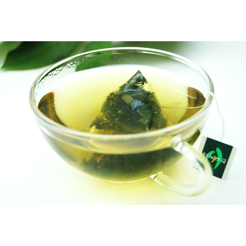 mulberry leaf tisane steeped in glass cup