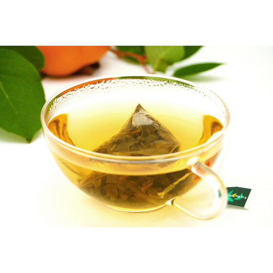 persimmon leaf sachet steeped in glass cup